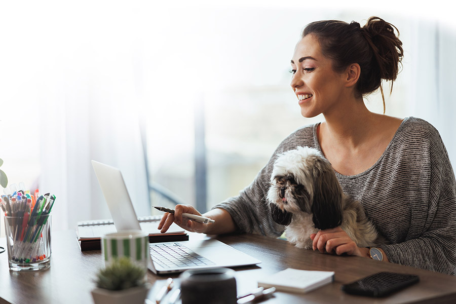 woman with dog trying to work out finances image is for decoration 